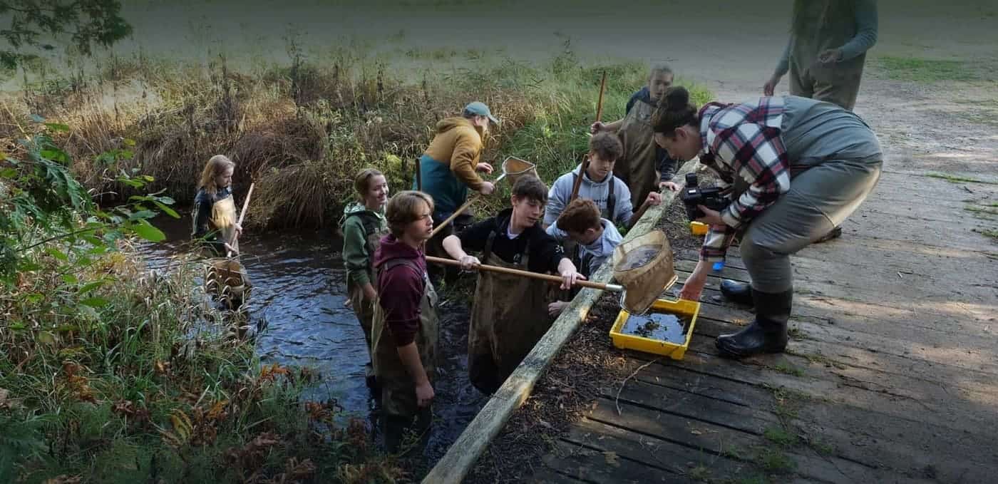 Students monitoring Michigan creek